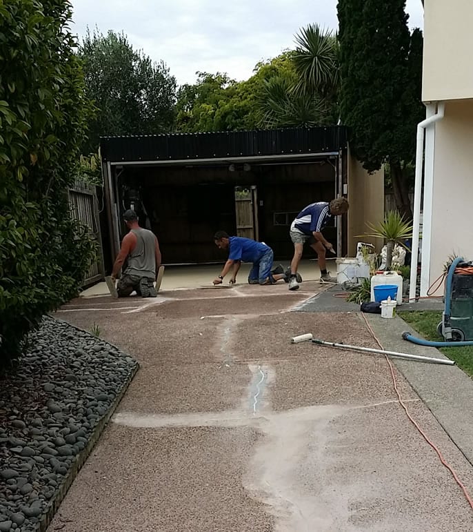cracked driveway being resurfaced