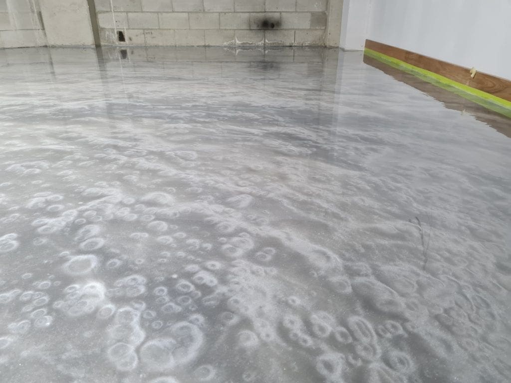 Metallic FX = Custom Silver metallic epoxy floor