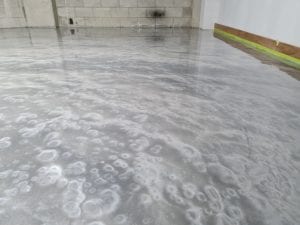Metallic FX = Custom Silver metallic epoxy floor